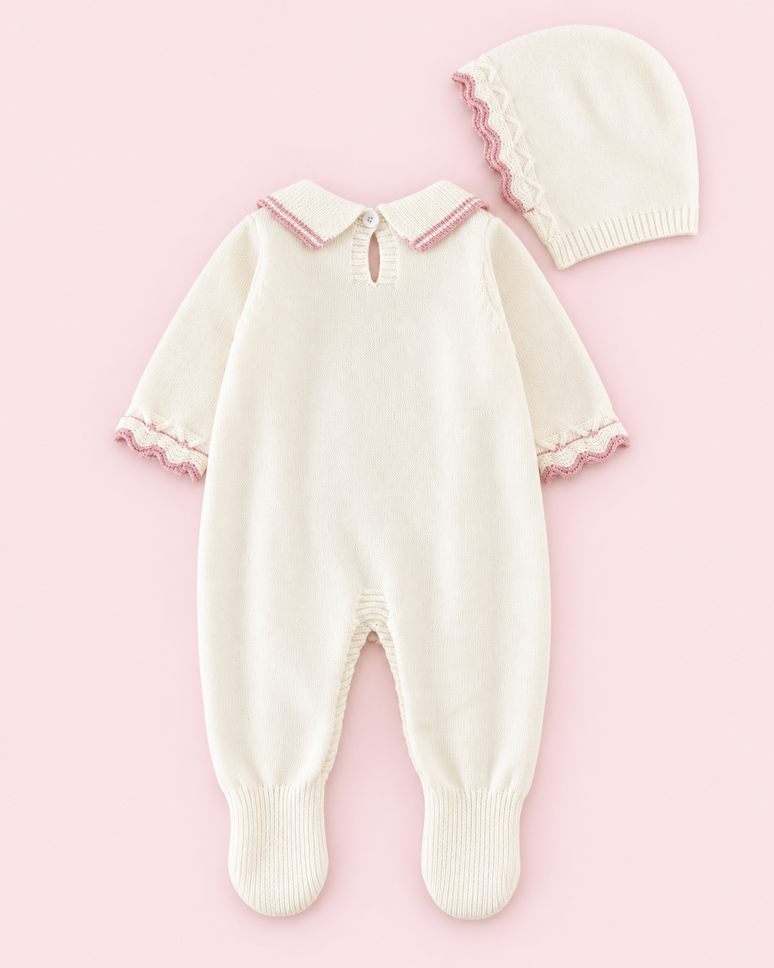 Cream knitted footed romper and bonnet, back view