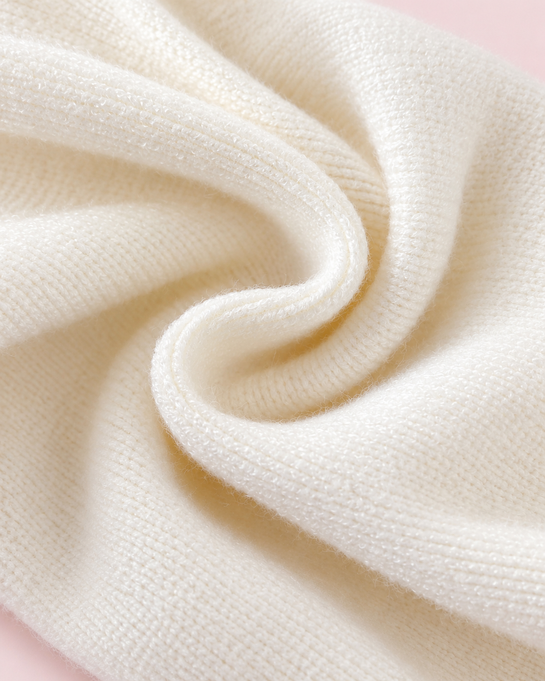 Cream knit fabric texture close-up